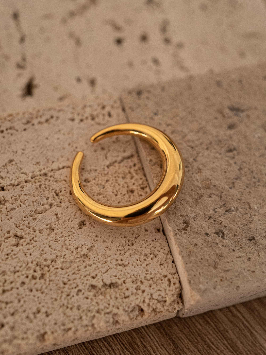 A polished gold ring.