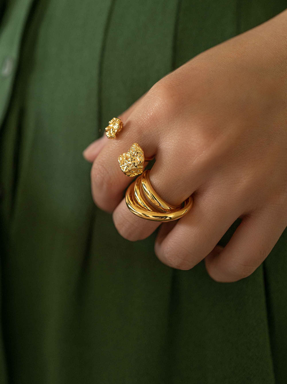 Finger wearing a gold ring