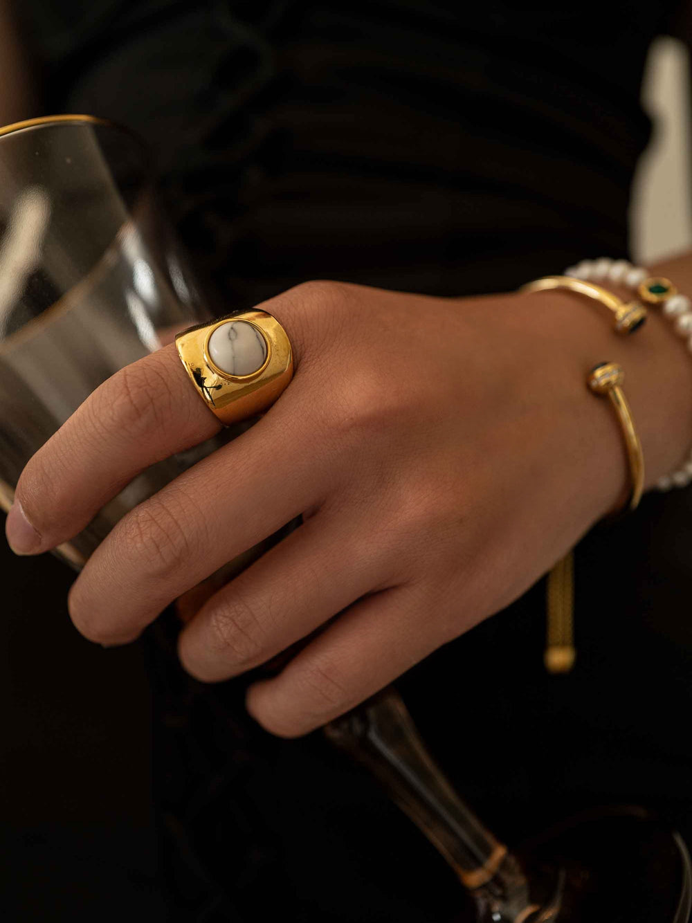 a hand with A golden marble ring