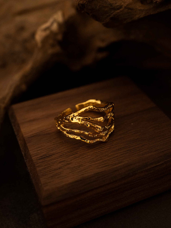 A multi-layered openwork gold ring