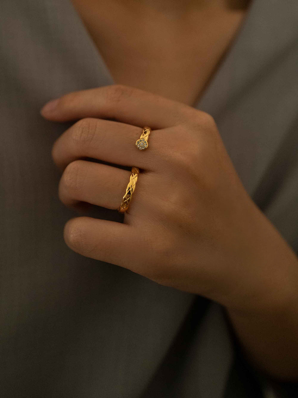 a model wear An S-shaped gold ring