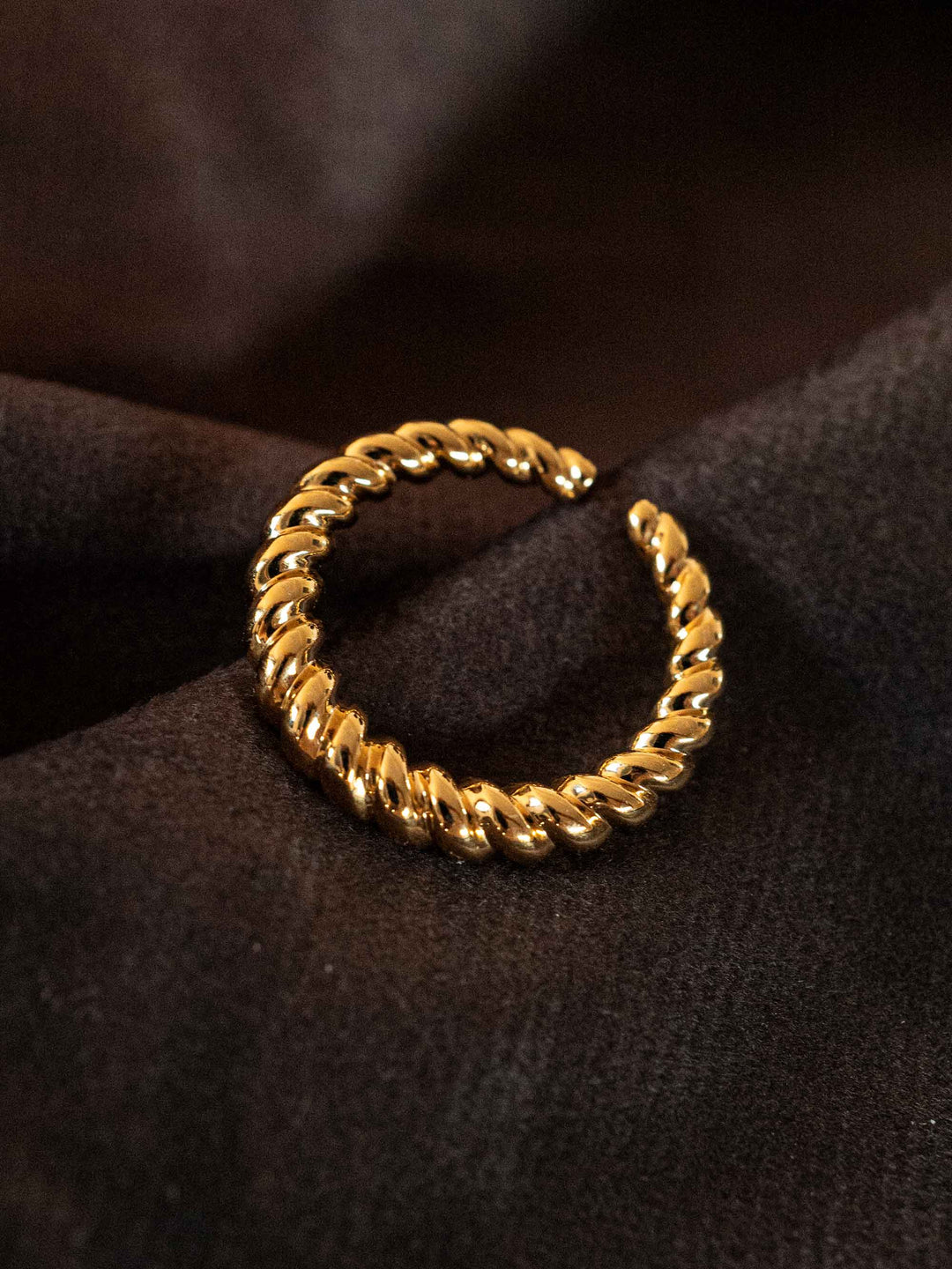 A gold twist ring.
