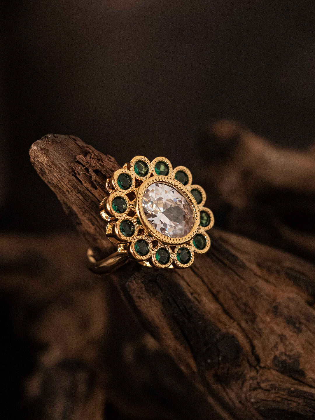 Gold ring with green and clear zircons