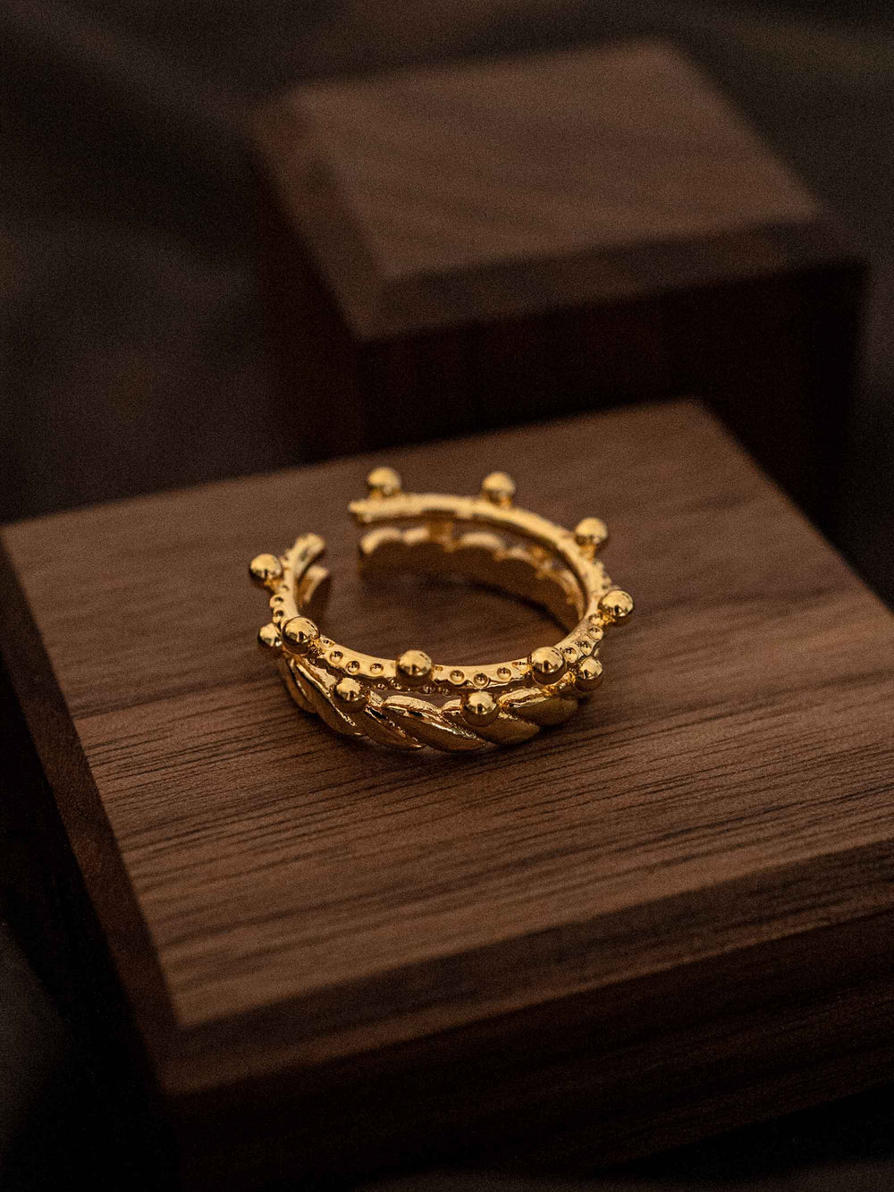One gold crown shaped ring