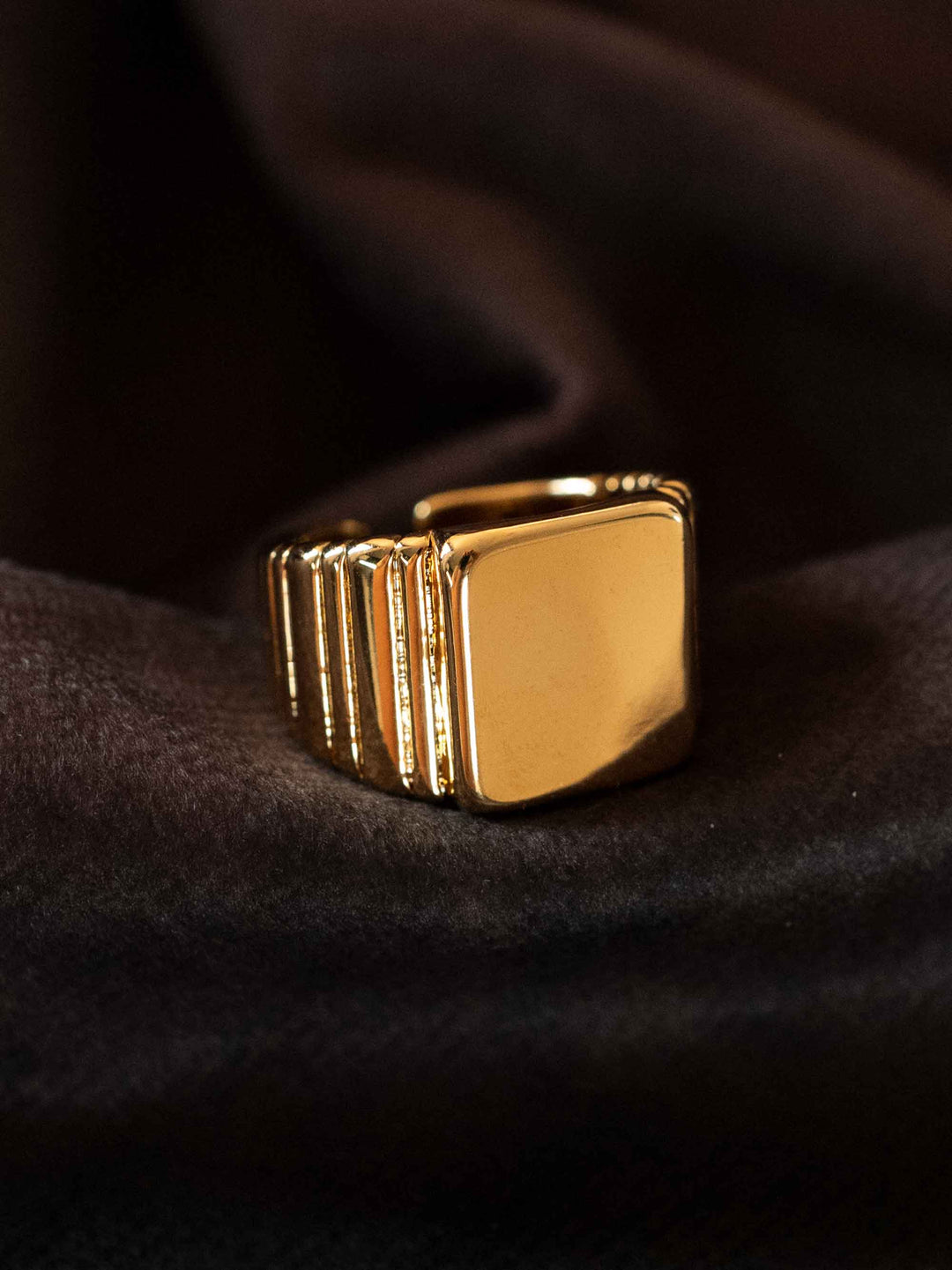 A gold geometric square ring
