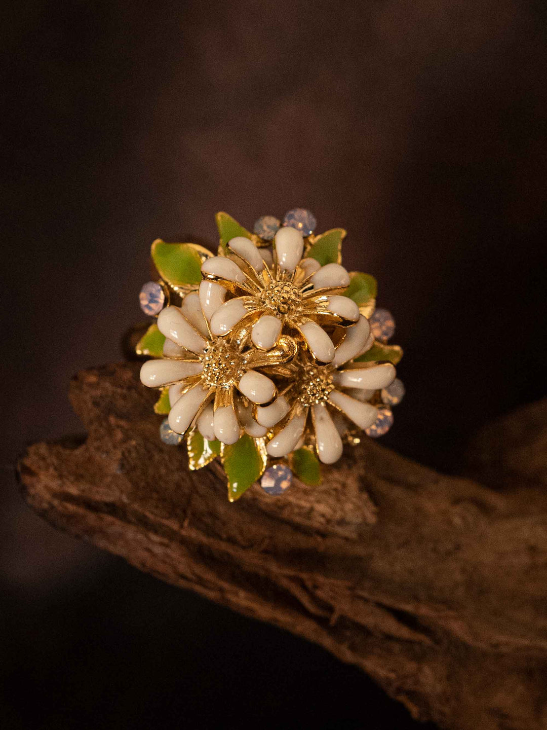A cold enamel white flower ring