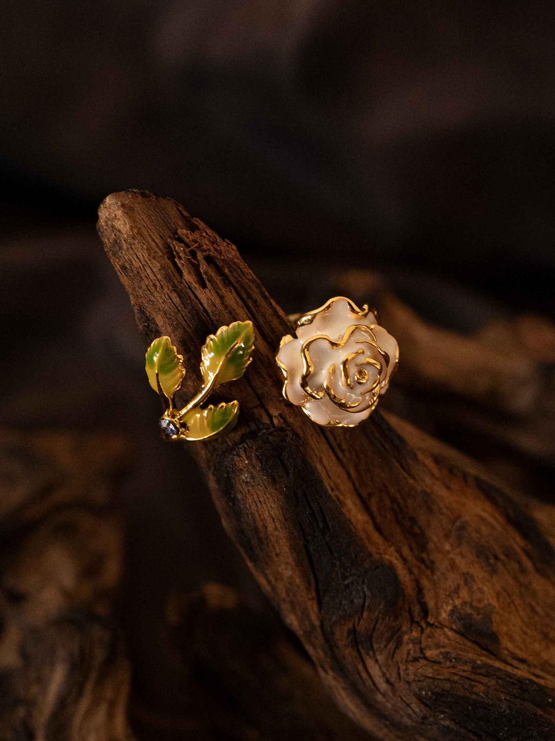 A gold rose flower and leaf ring