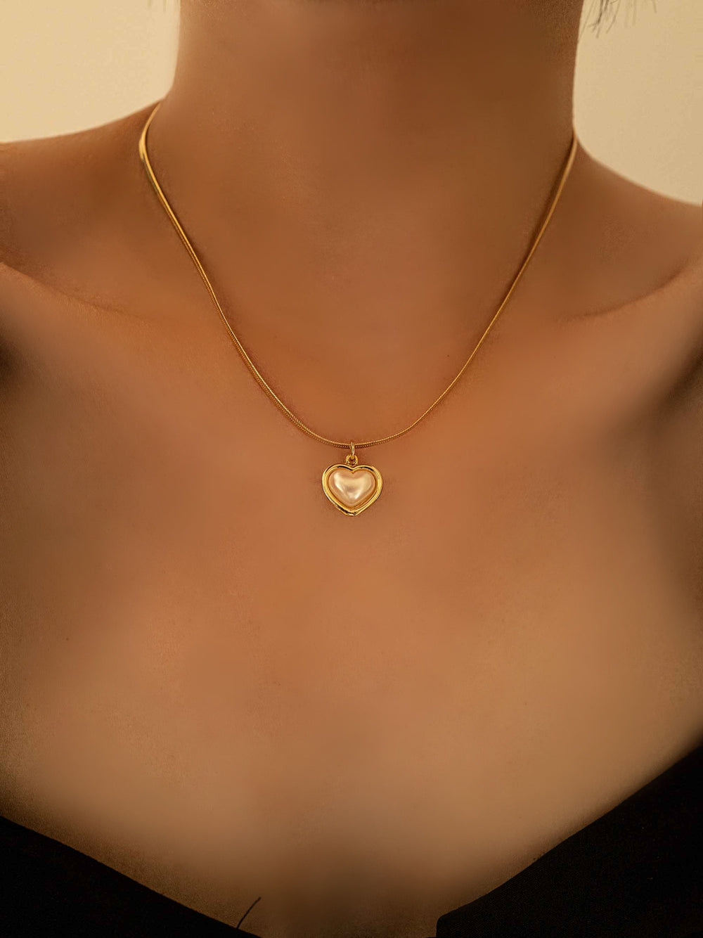 model with A love pendant necklace