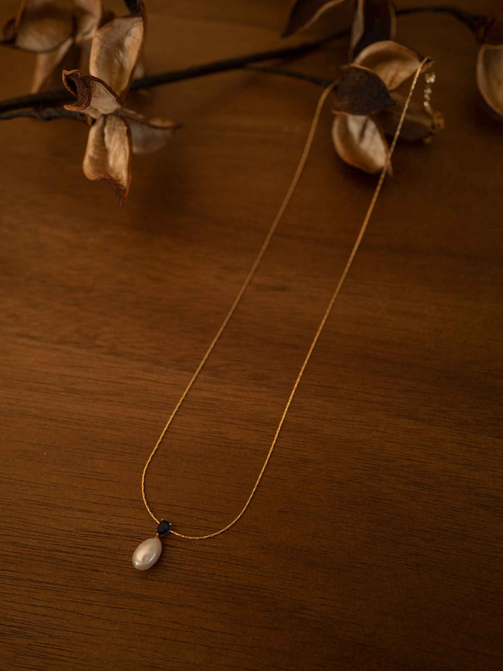 a minimalist design of pearl necklace