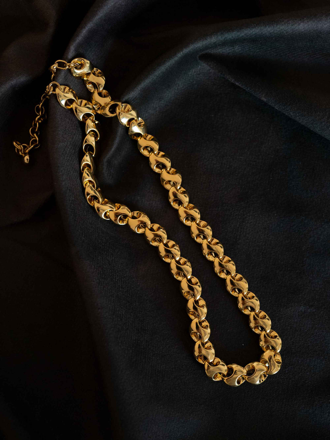 A gold necklace with interlocking rings