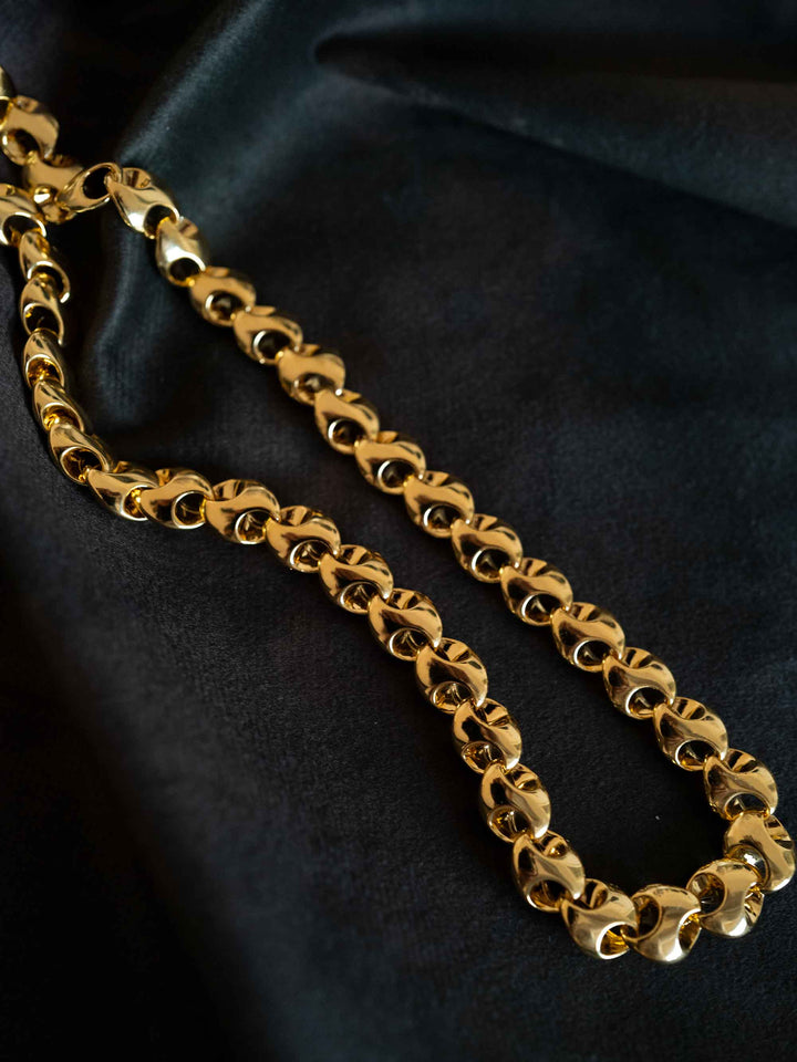 A gold necklace with interlocking rings