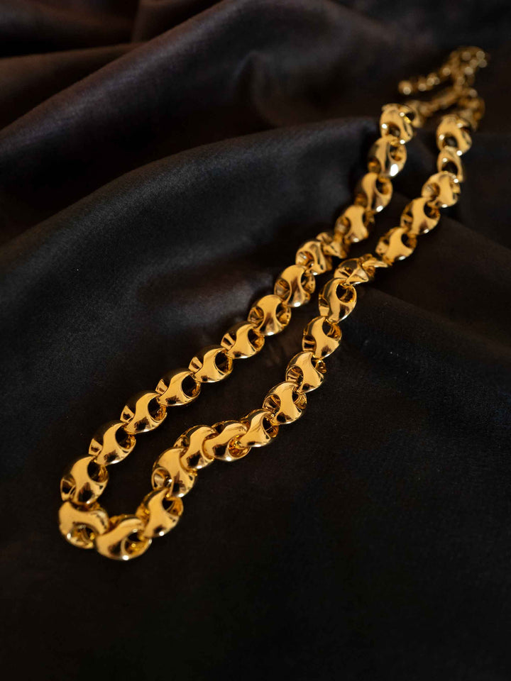 A gold necklace with interlocking rings