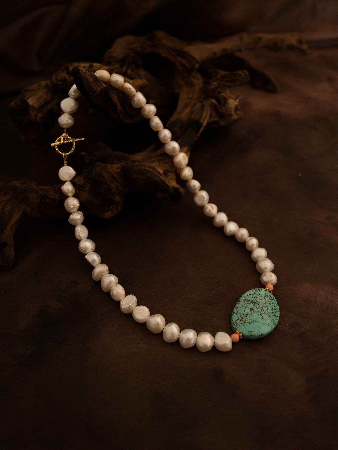 A necklace of natural stones and pearls