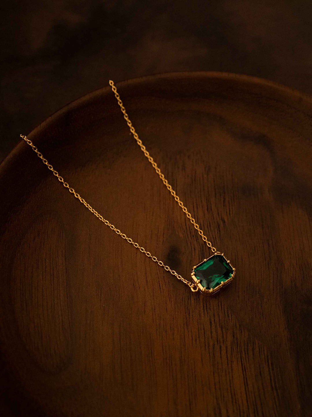 A green crystal gold necklace