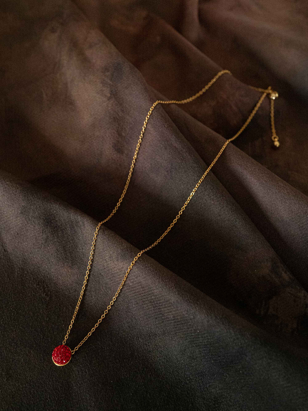 A necklace with red glass crystals