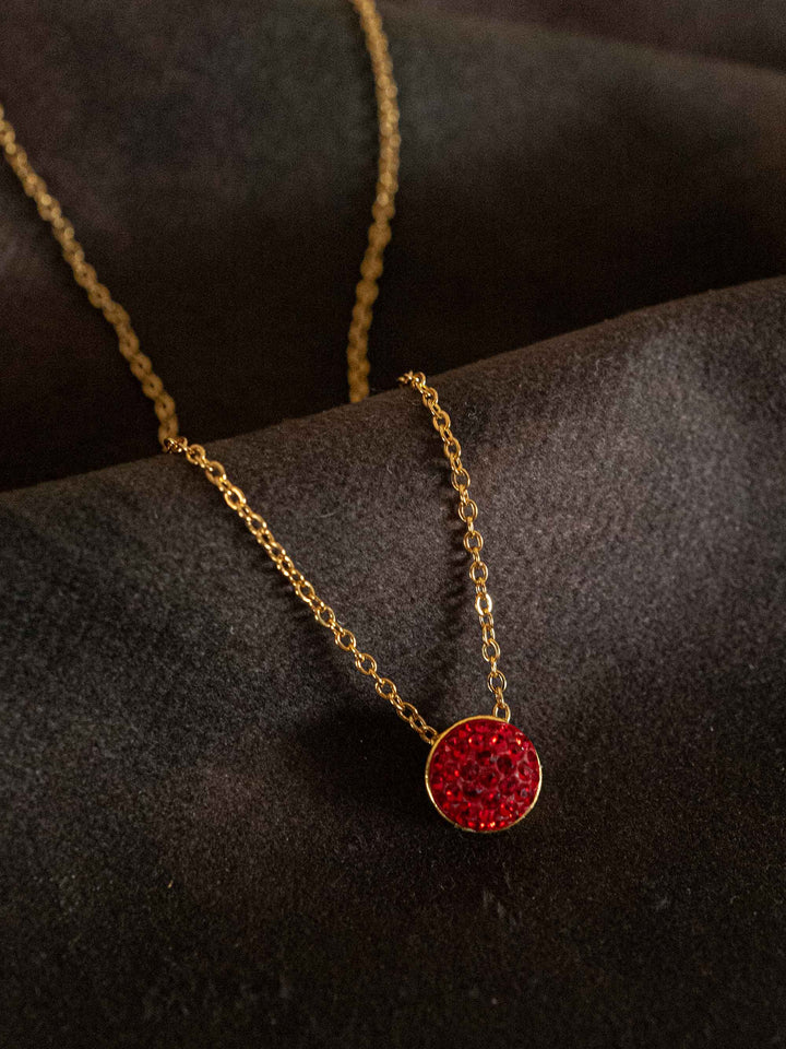 A necklace with red glass crystals