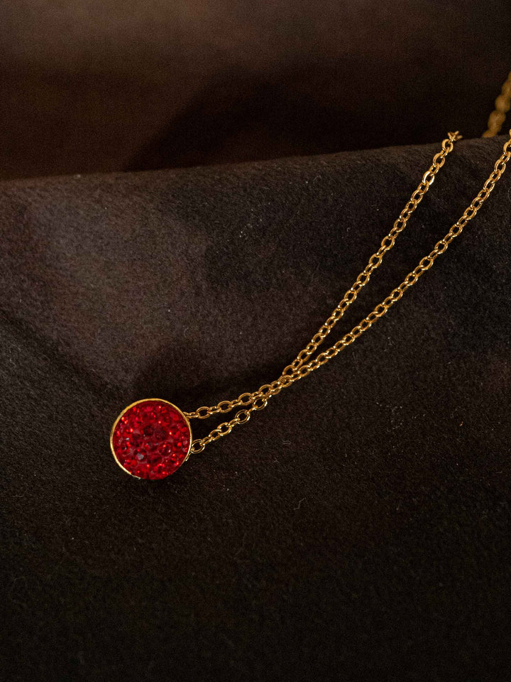 A necklace with red glass crystals