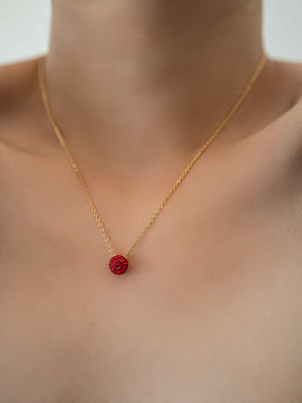 a model wear A necklace with red glass crystals