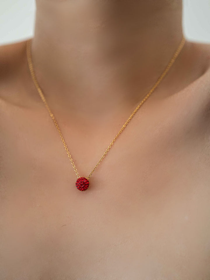 a model wear A necklace with red glass crystals