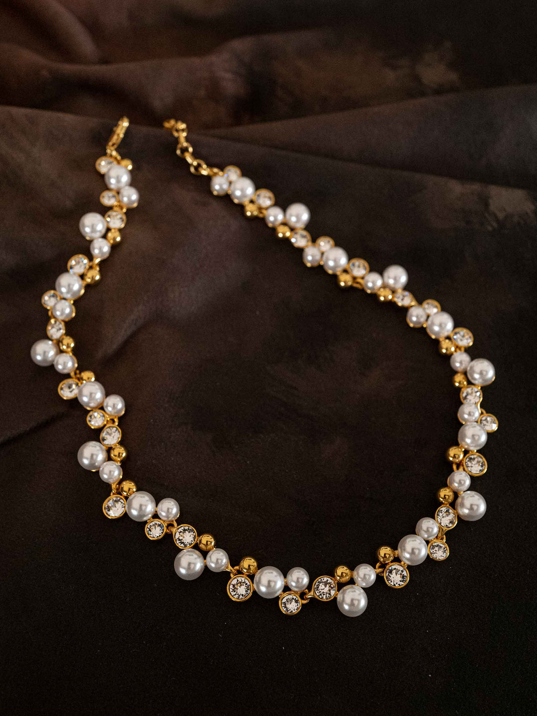 A necklace of pearls and glass crystals