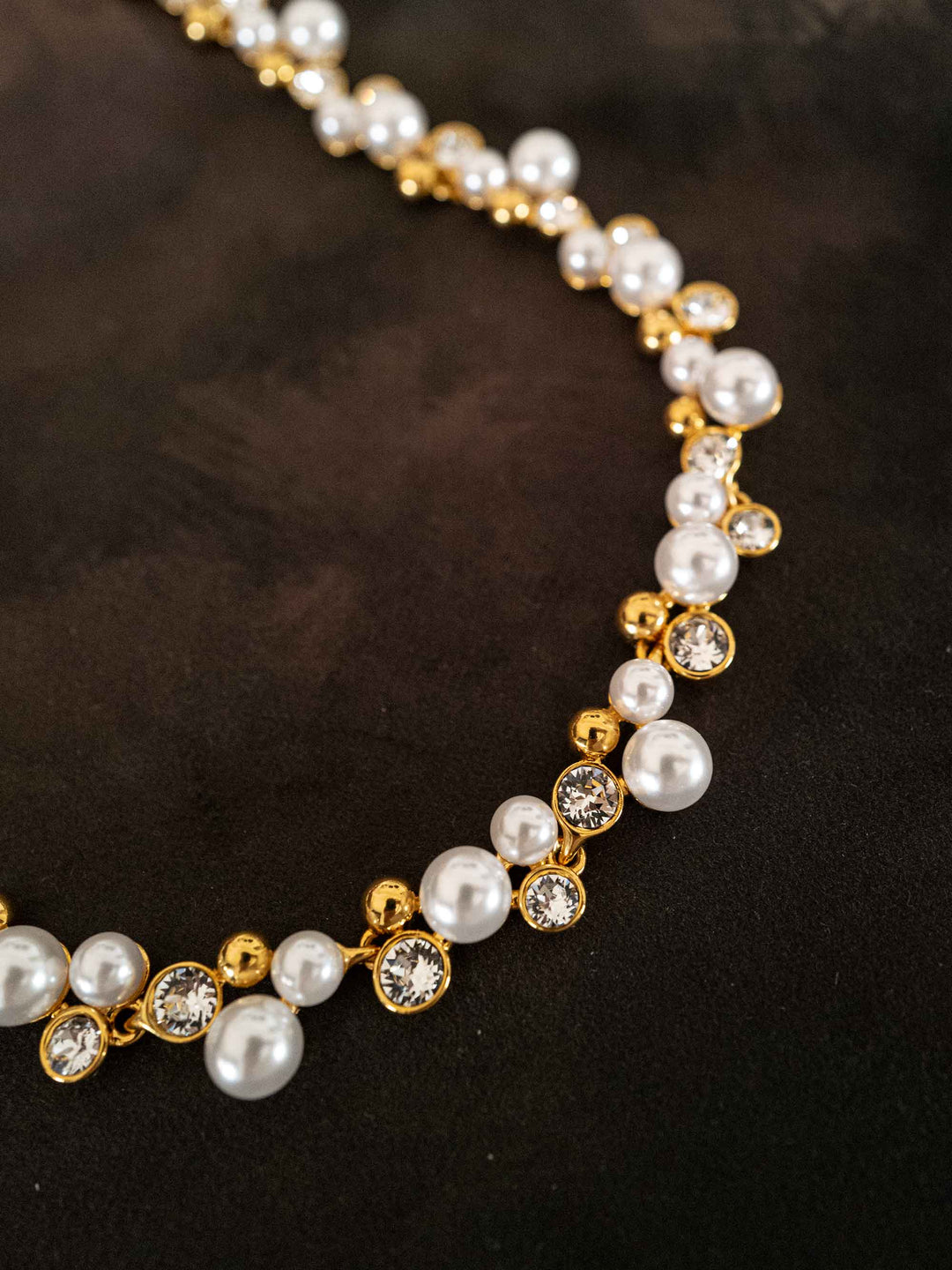 A necklace of pearls and glass crystals