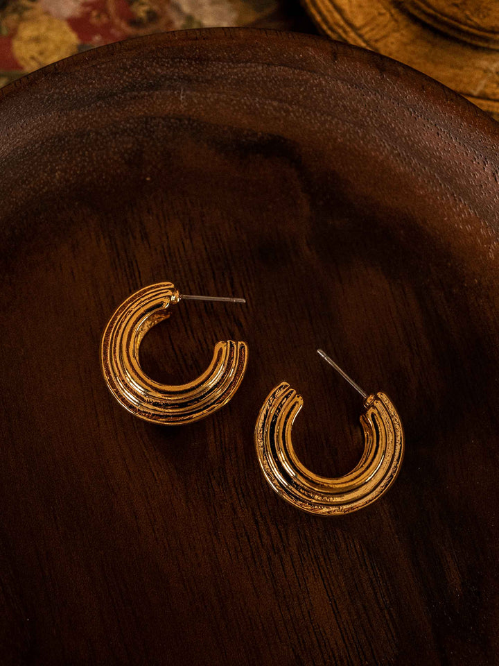 A pair of gold hoop earrings