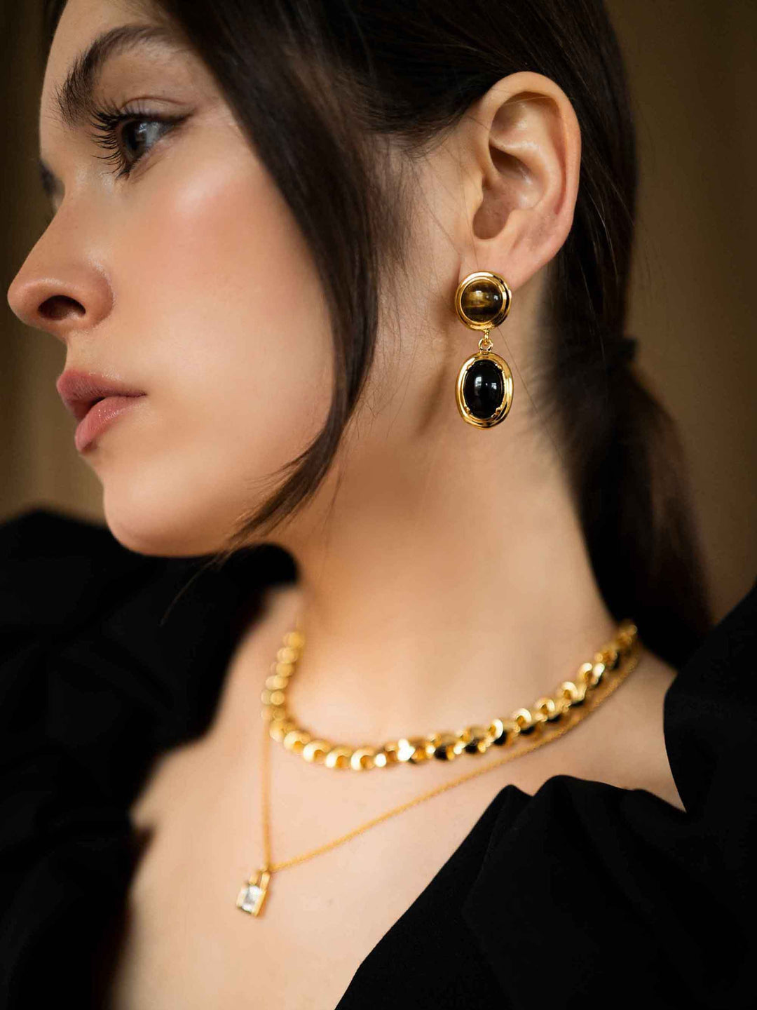 model wears Cat's Eye Black Stone Gold Earrings