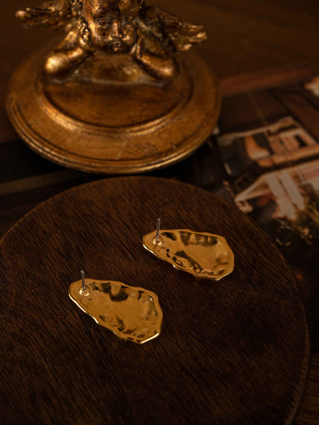 A pair of gold irregular stone shaped earrings 