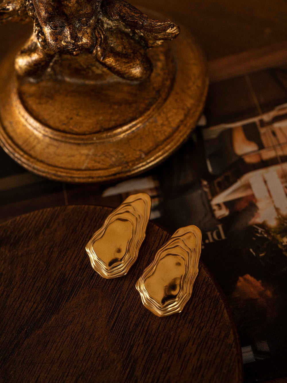 A pair of gold irregular stone shaped earrings 