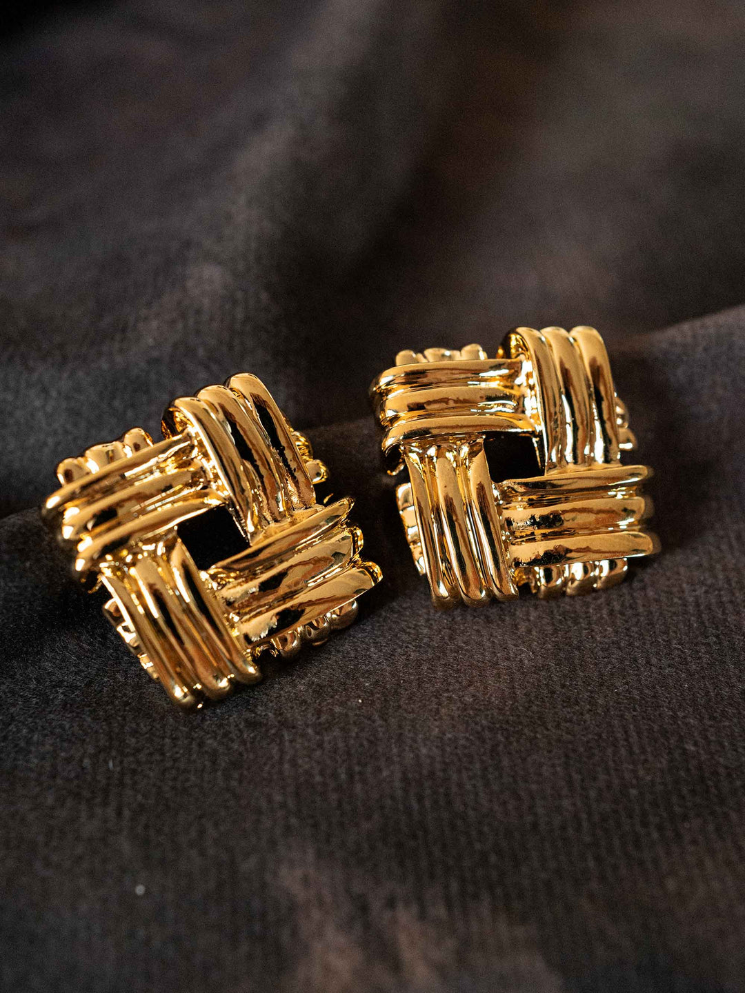 A pair of gold-colored openwork square earrings