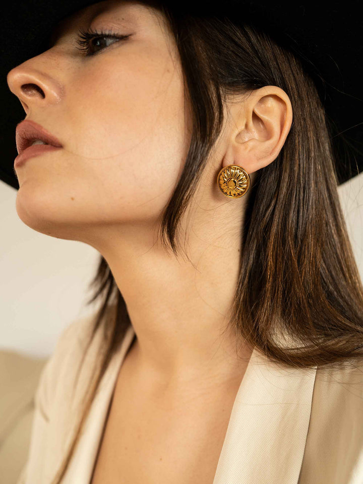 model wears Golden Flower Round Earrings