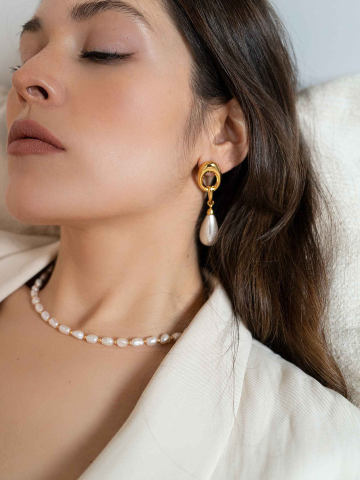 model wears Golden Crystal Pearl Earrings