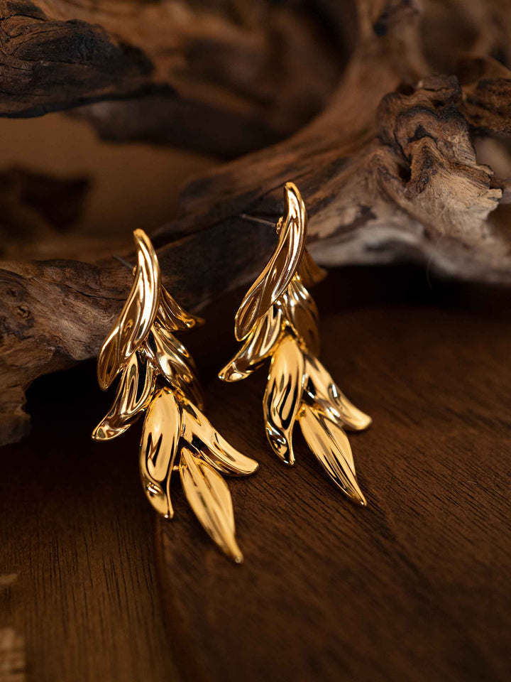 Gold earrings in the shape of olive leaves