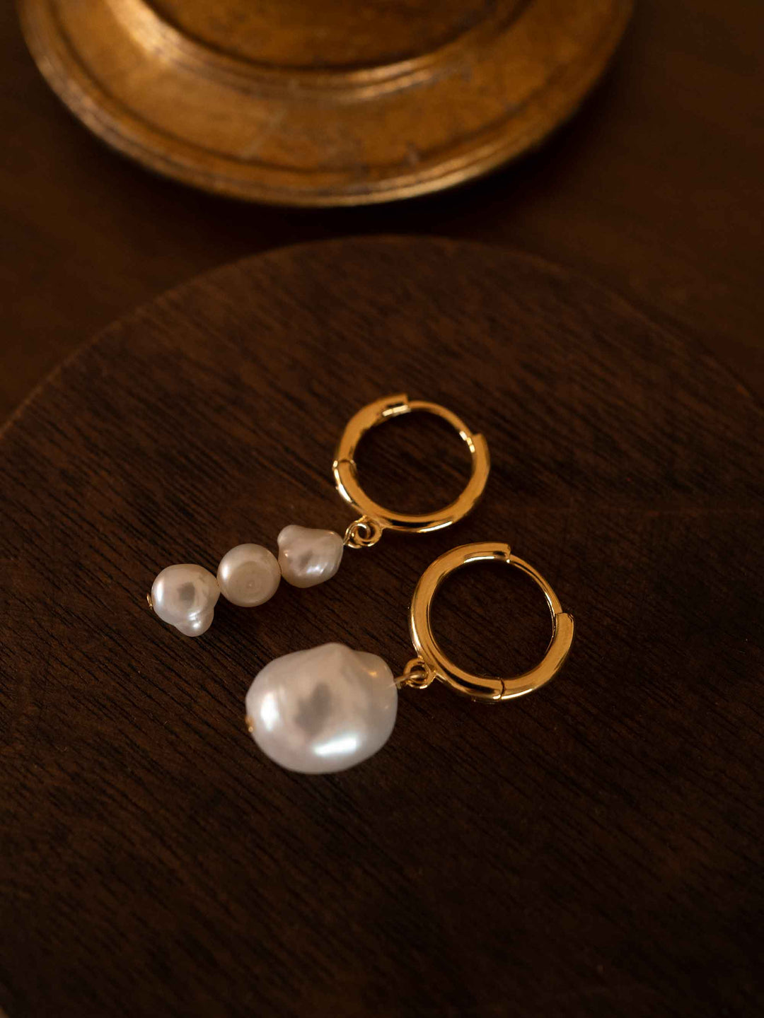 A pair of asymmetrical baroque pearl earrings