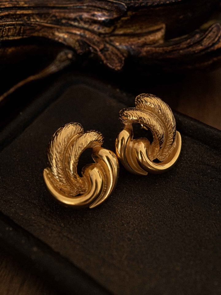 One gold earring