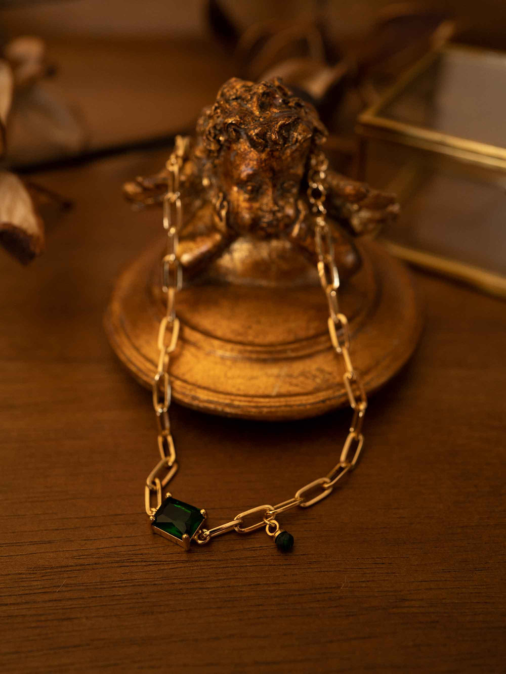 A bracelet with green stones