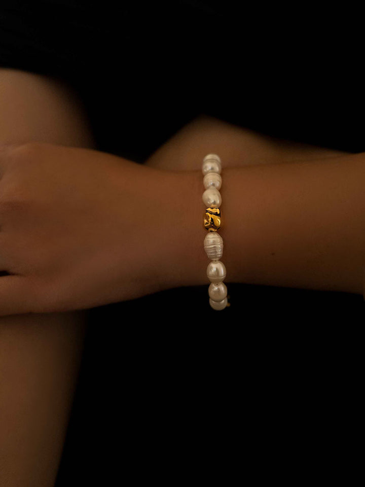 a hand wear A pearl beaded bracelet