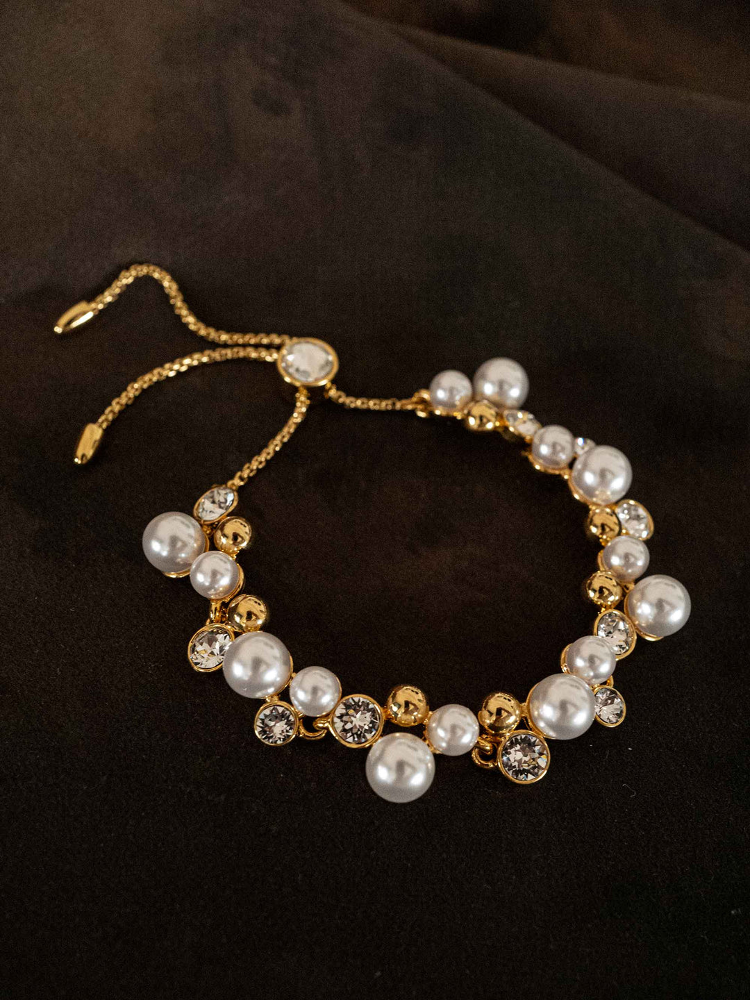 A bracelet of pearls and glass crystals