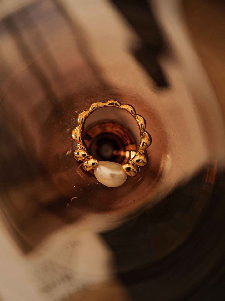 A gold ring with cultured pearls