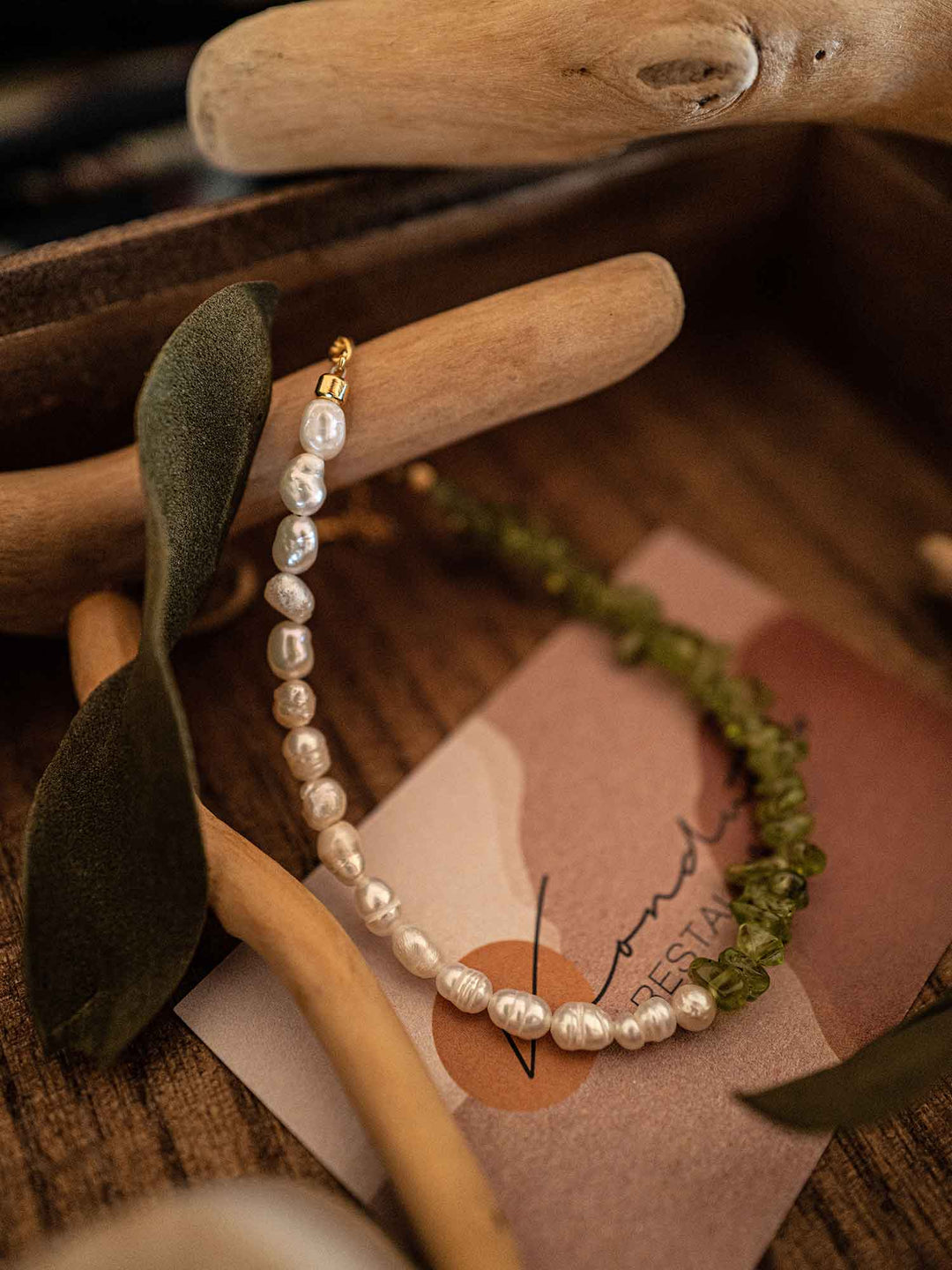 A bracelet of green stones and pearls